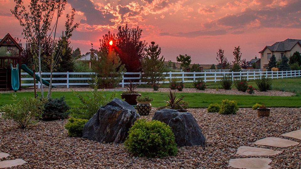 Kids playground in the backyard with a beautiful sunset view