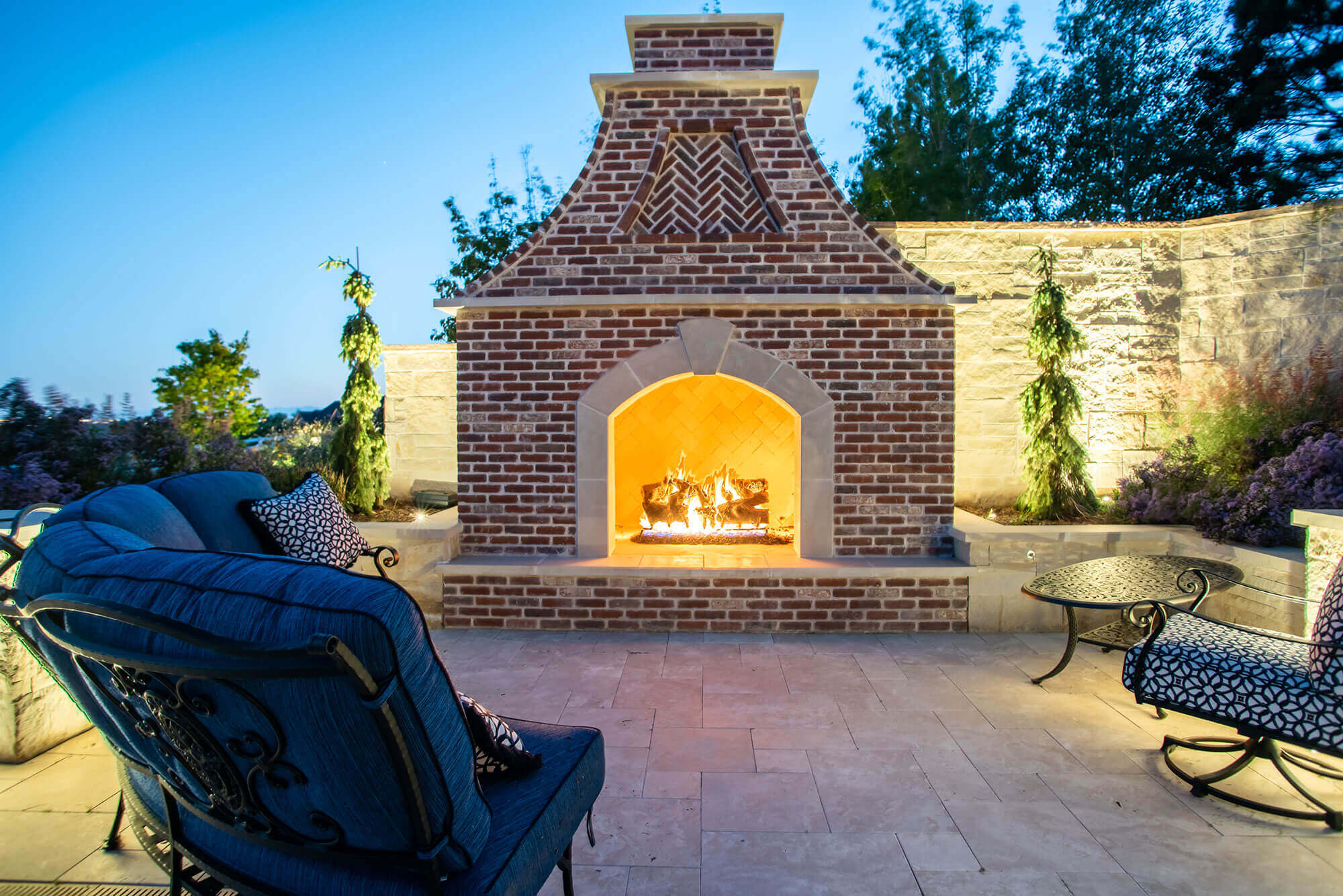 Outdoor space with warming fire place and sofas