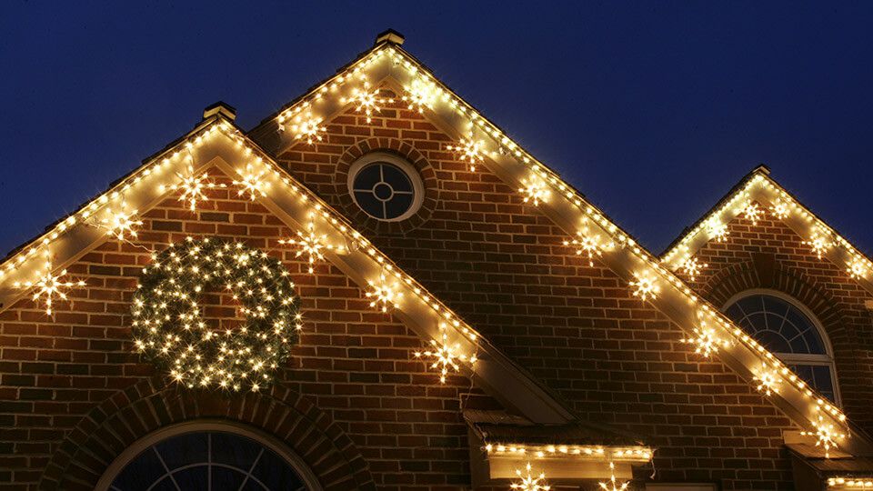 A House is fully decorated with colourful star lighting for christmas and new year eve
