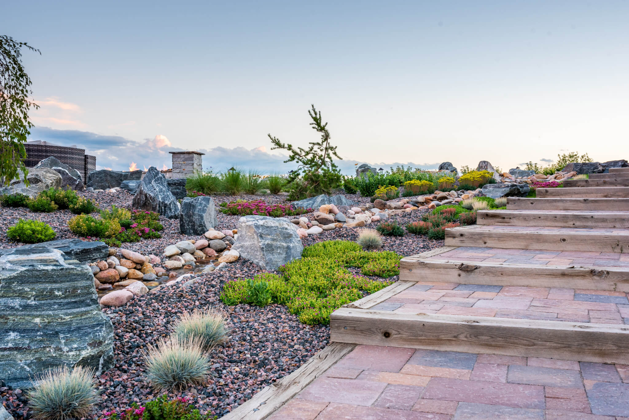 Steps with water stream on the side, flower, plants, and trees