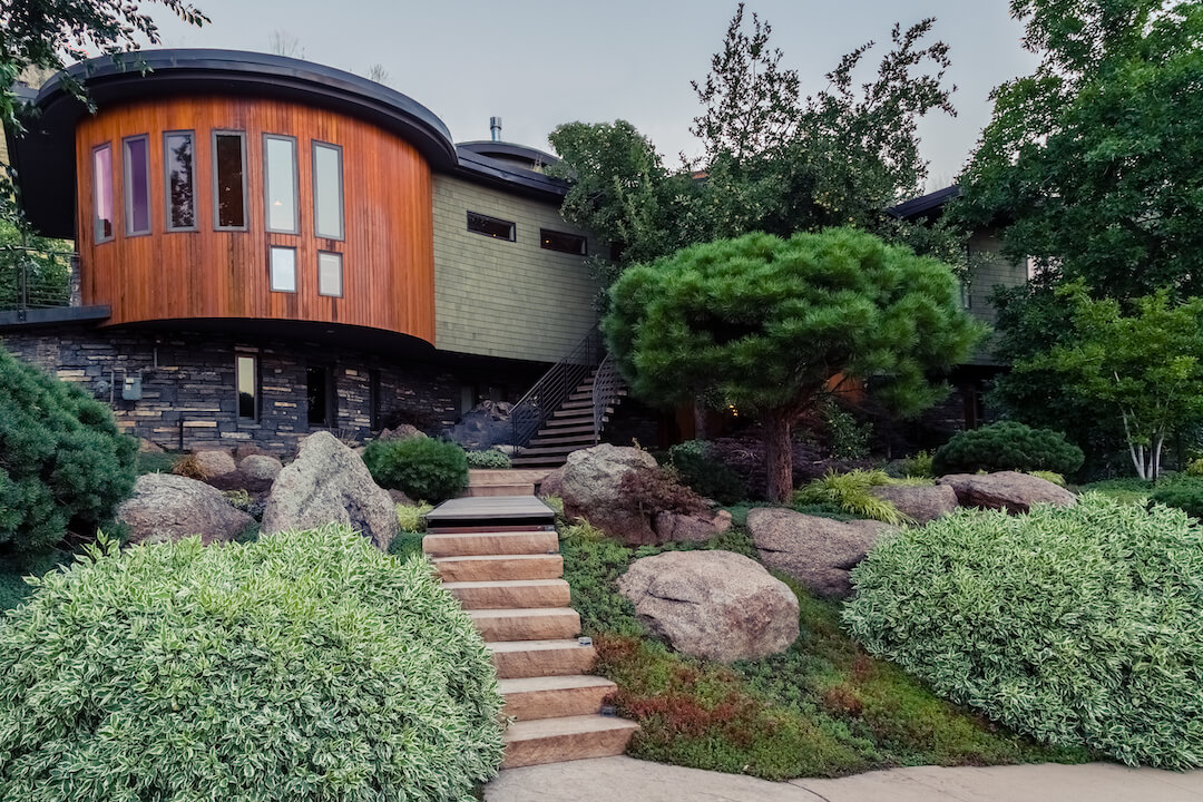 A Home Adorned with Trees & Shrubs Landscaping