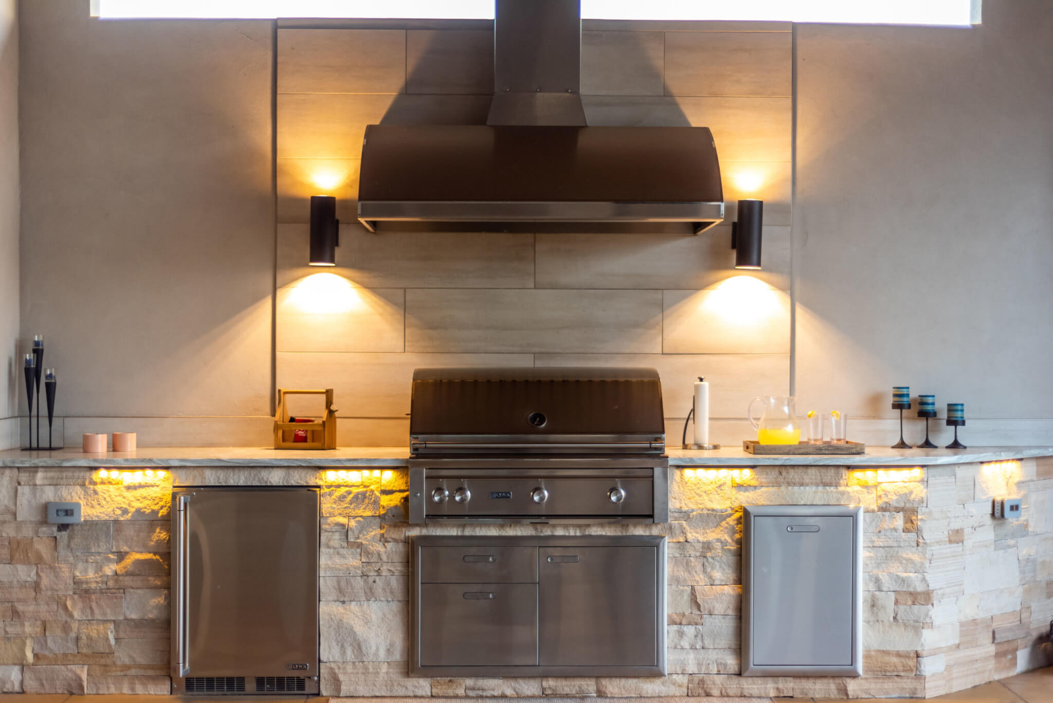 Outdoor kitchen with lights, cups, and chimney