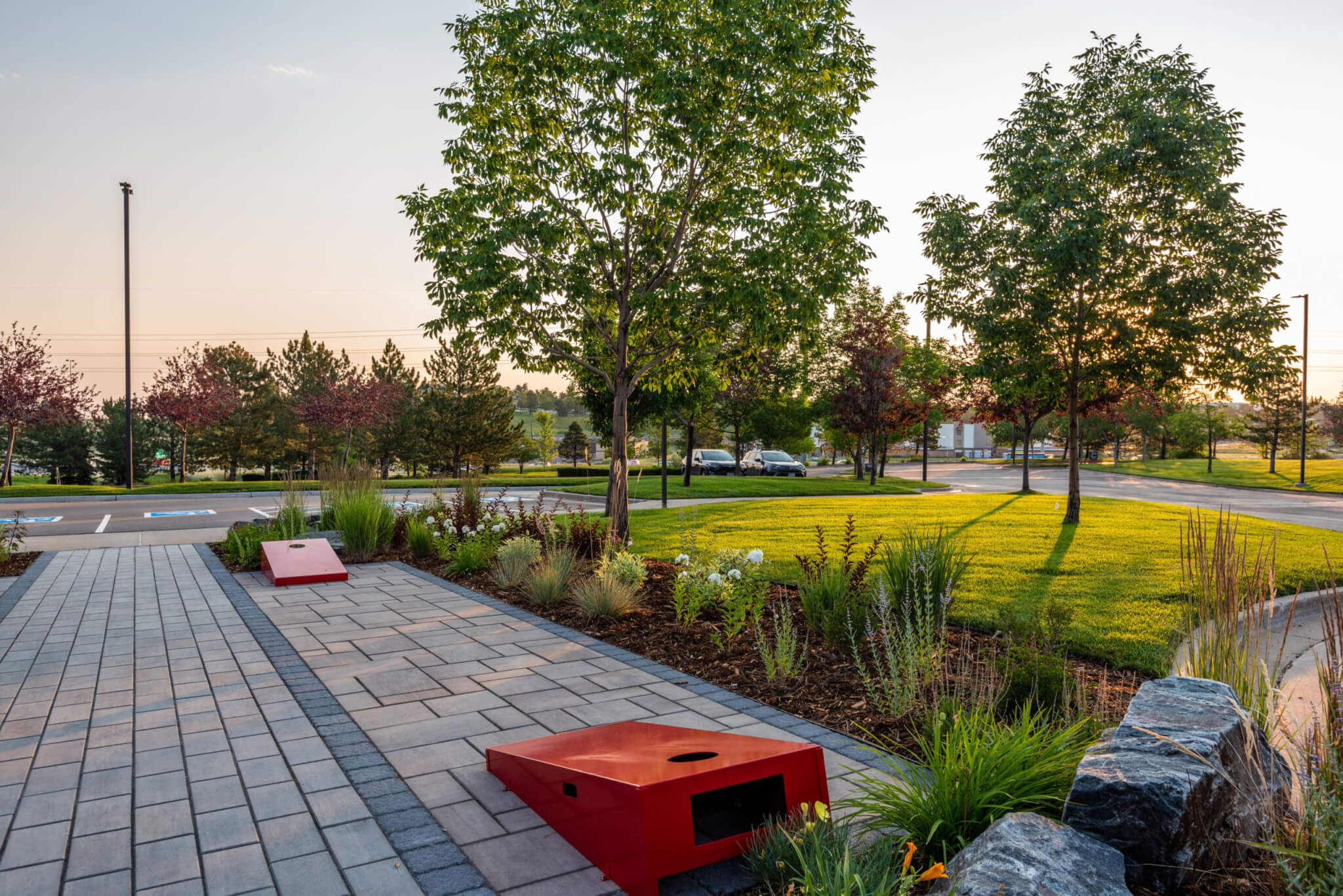 Path way leading to parking lot along with plants and trees