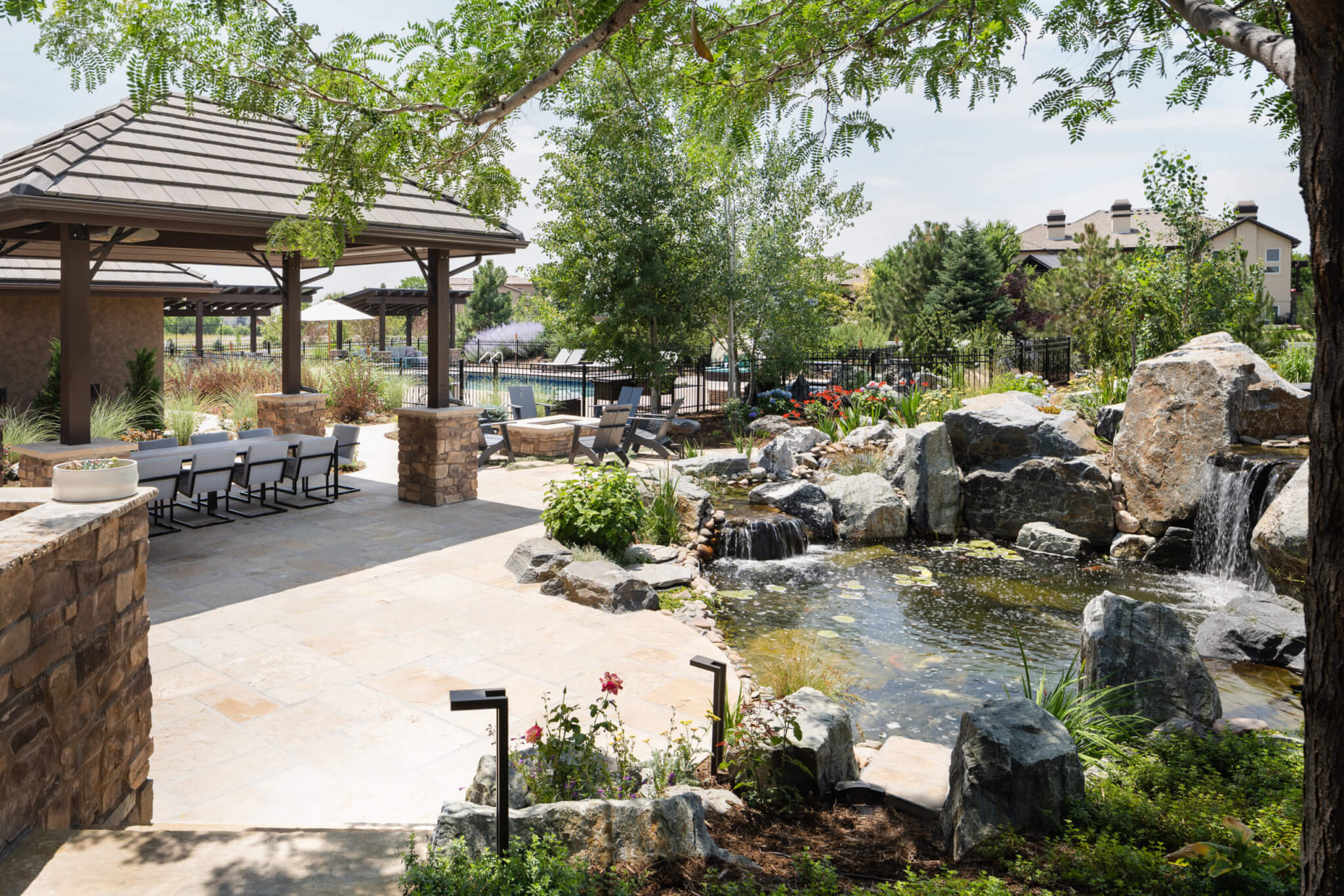 Koi fish pond with a man-made constructed mini waterfall