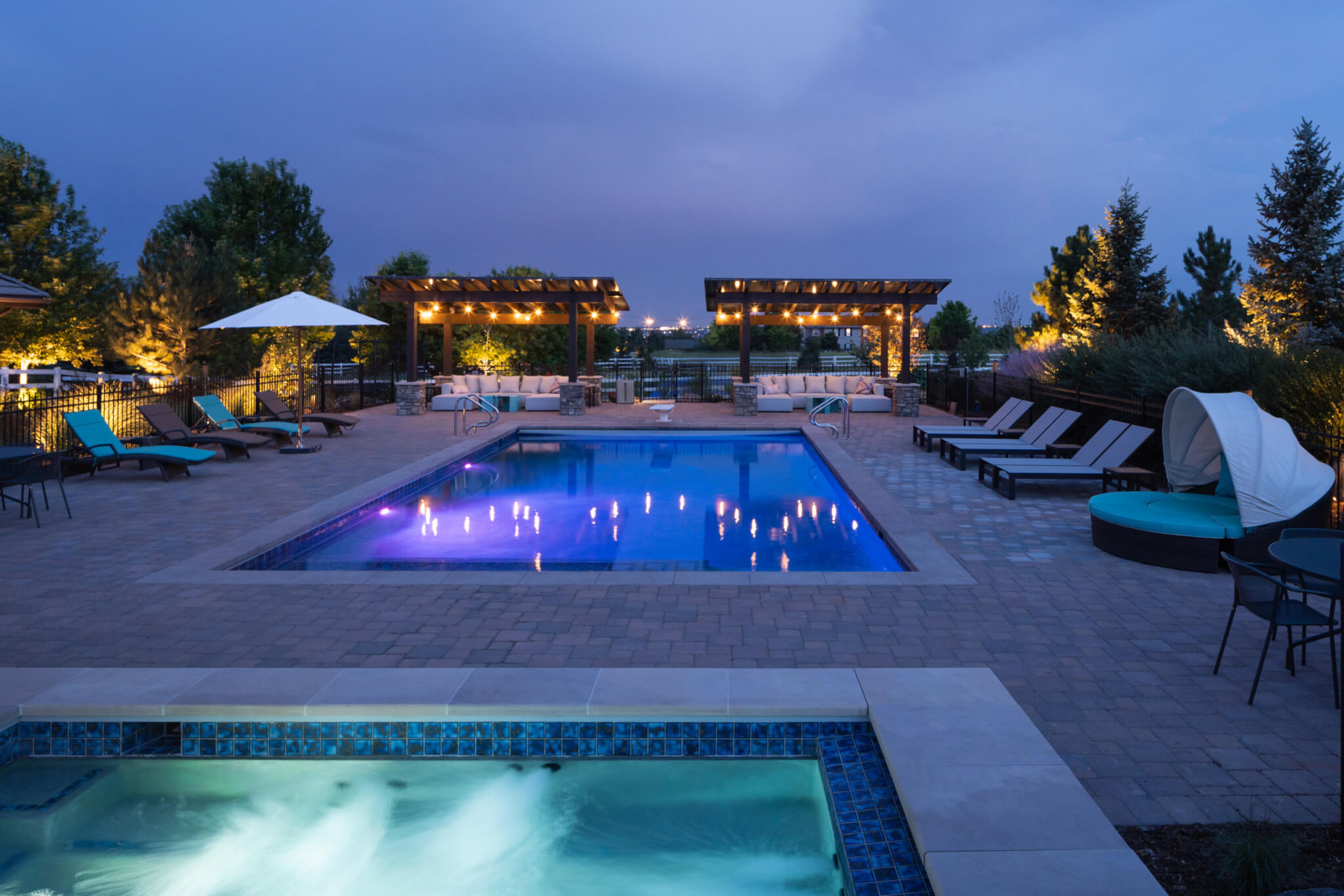 Pool with outdoor furniture on each side