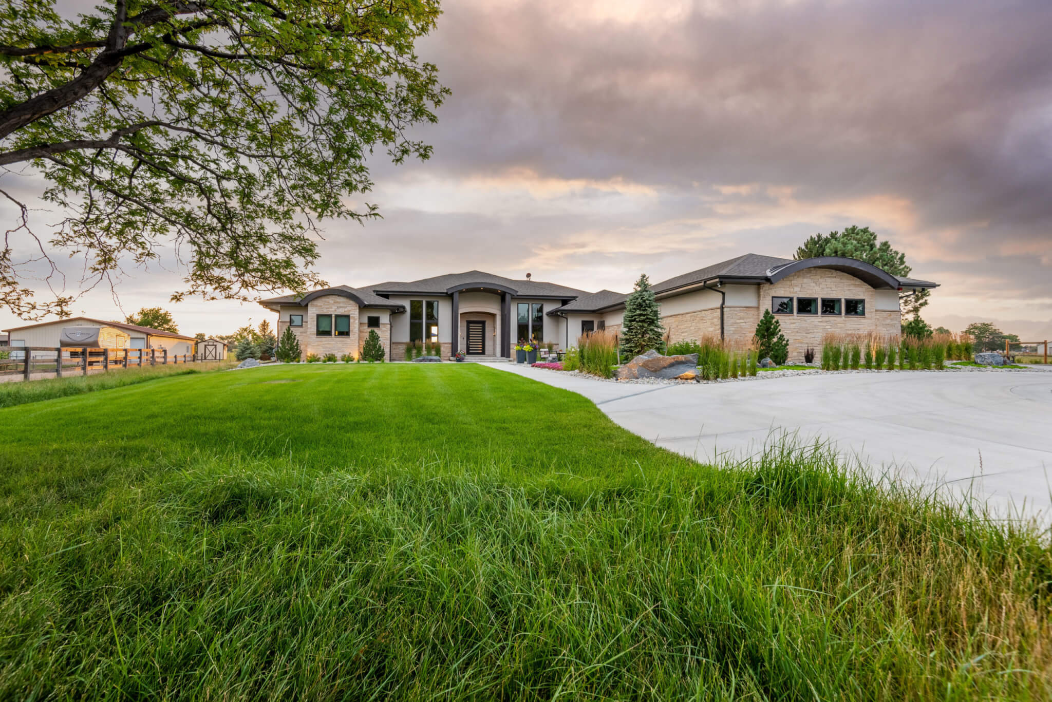 Front view of the house from grass field with pathway