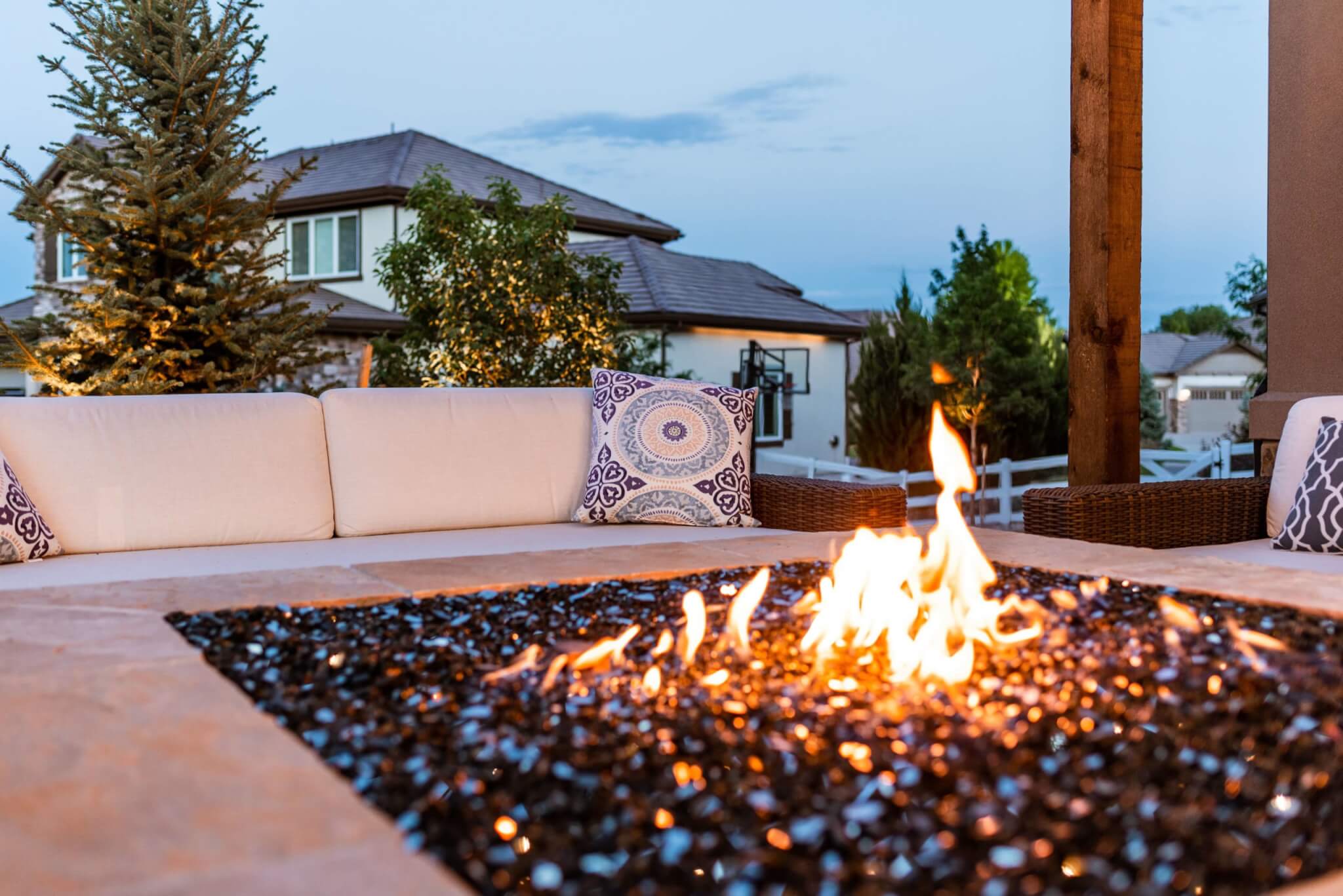 Fire pit in front of the sofa in outside sitting area