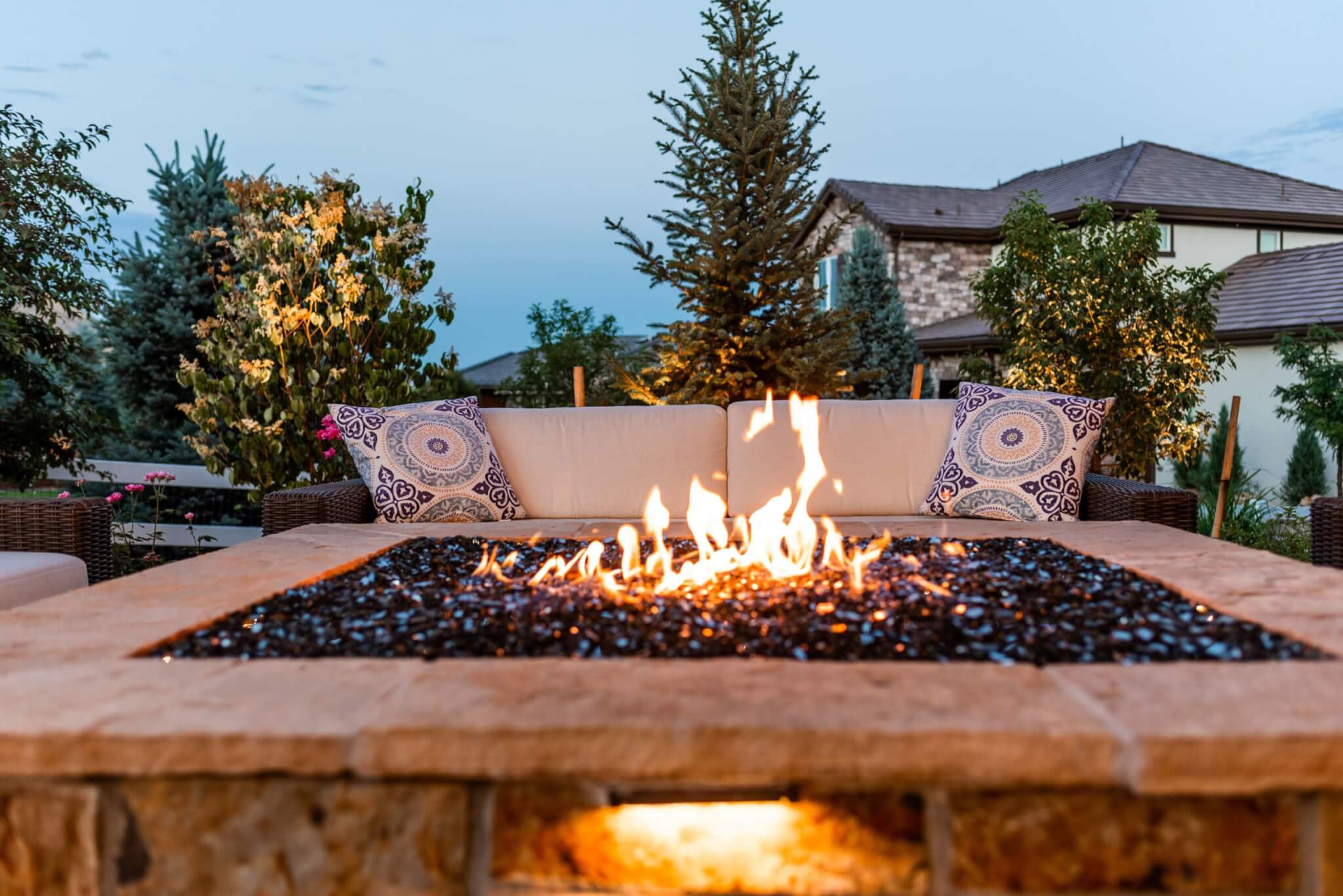 Fire pit in front of the sofa in outside sitting area