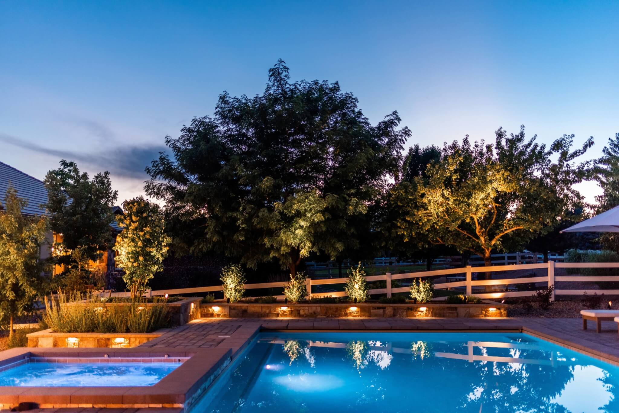 Swimming pool area with plants and trees